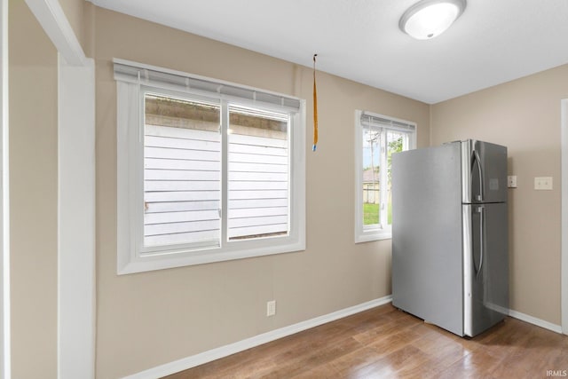 1510 W 4th St, Fort Wayne, IN 46808 - kitchen with freestanding refrigerator, wood finished floors, and baseboards