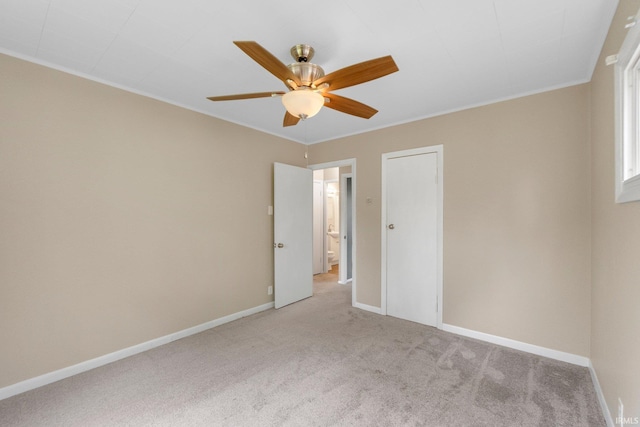 1510 W 4th St, Fort Wayne, IN 46808 - unfurnished bedroom featuring light colored carpet, baseboards, crown molding, and ceiling fan