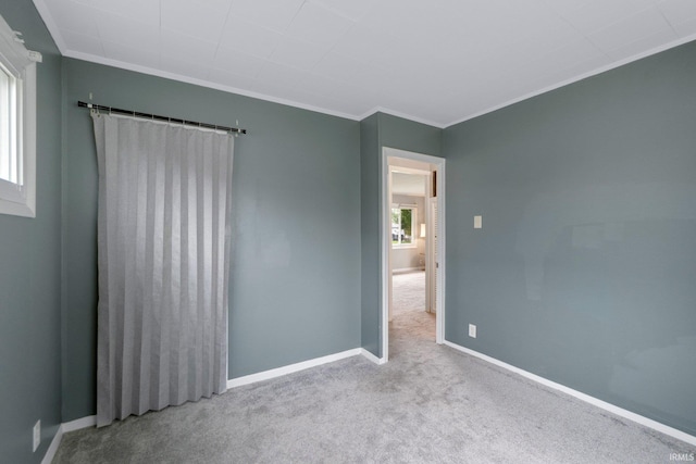 1510 W 4th St, Fort Wayne, IN 46808 - spare room with crown molding, carpet flooring, and baseboards