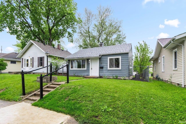 1510 W 4th St, Fort Wayne, IN 46808 - view of front of house with a front yard and a chimney