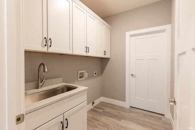 1590 S Renwick Blvd, Bloomington, IN 47401 - washroom featuring electric dryer hookup, cabinet space, washer hookup, baseboards, and light wood finished floors