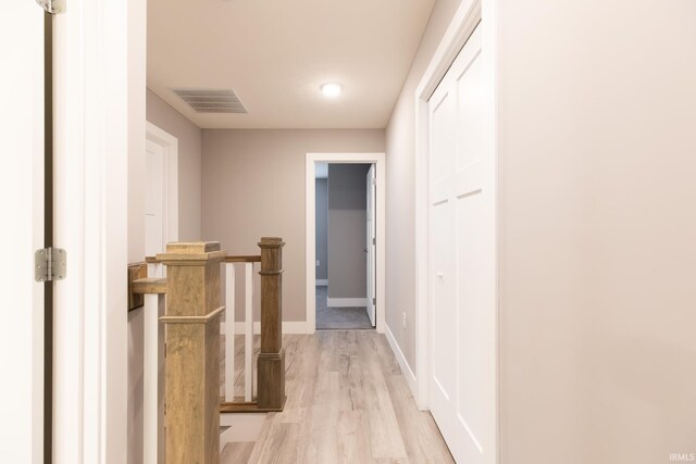 1590 S Renwick Blvd, Bloomington, IN 47401 - corridor with light wood finished floors, baseboards, and an upstairs landing