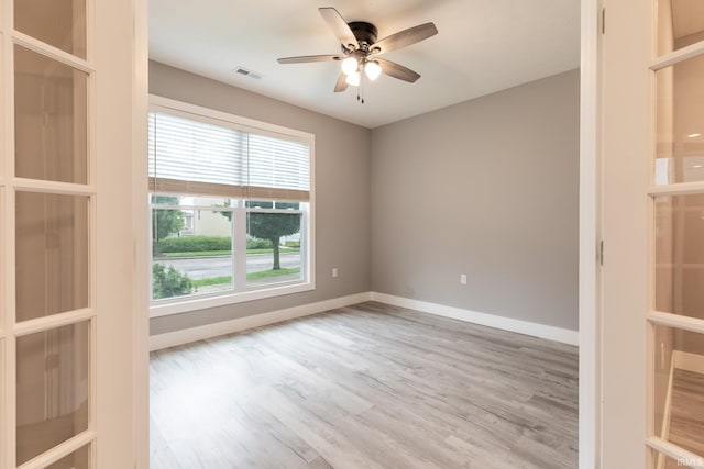 1590 S Renwick Blvd, Bloomington, IN 47401 - empty room with a ceiling fan, baseboards, and wood finished floors