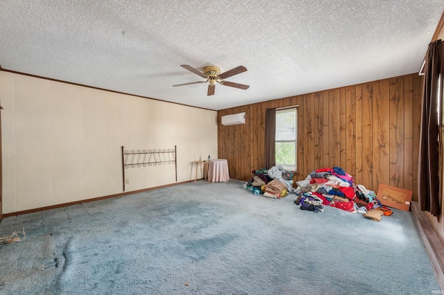 5668 E 500 S, Lynn, IN 47355 - carpeted empty room with a ceiling fan, a textured ceiling, a wall unit AC, wooden walls, and baseboards