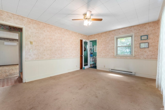 5668 E 500 S, Lynn, IN 47355 - carpeted spare room with baseboard heating, wainscoting, a ceiling fan, and a wall unit AC