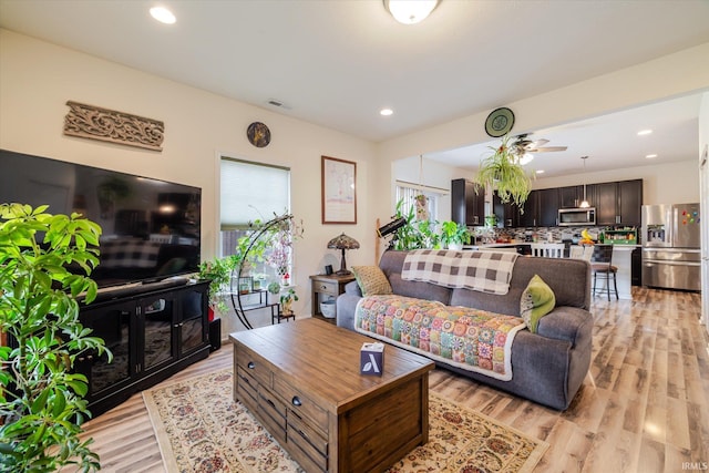 4671 W Hidden Meadow Dr, Bloomington, IN 47404 - living area with light wood finished floors, a ceiling fan, and recessed lighting