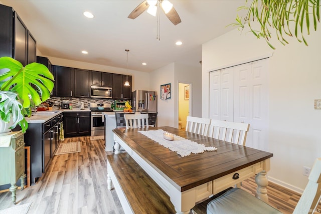 4671 W Hidden Meadow Dr, Bloomington, IN 47404 - dining area with light wood-style floors, a ceiling fan, and recessed lighting