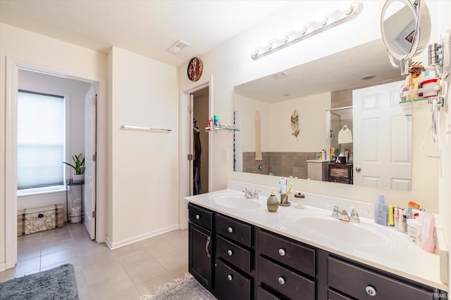 4671 W Hidden Meadow Dr, Bloomington, IN 47404 - bathroom with walk in shower, double vanity, and tile patterned flooring