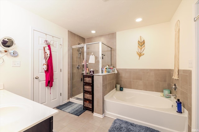 4671 W Hidden Meadow Dr, Bloomington, IN 47404 - full bath featuring tile patterned floors, a stall shower, a bath, recessed lighting, and vanity