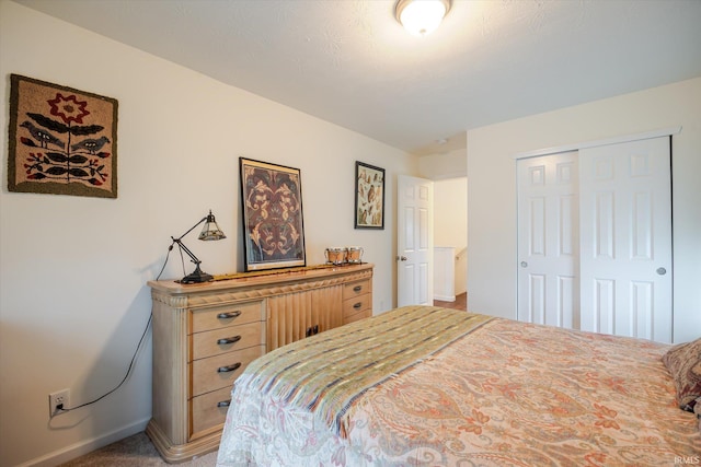 4671 W Hidden Meadow Dr, Bloomington, IN 47404 - bedroom featuring a closet, baseboards, and carpet flooring