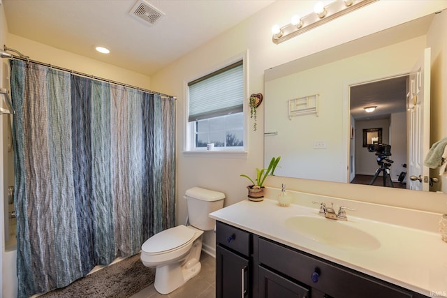 4671 W Hidden Meadow Dr, Bloomington, IN 47404 - bathroom featuring toilet, vanity, tile patterned floors, and shower / bathtub combination with curtain