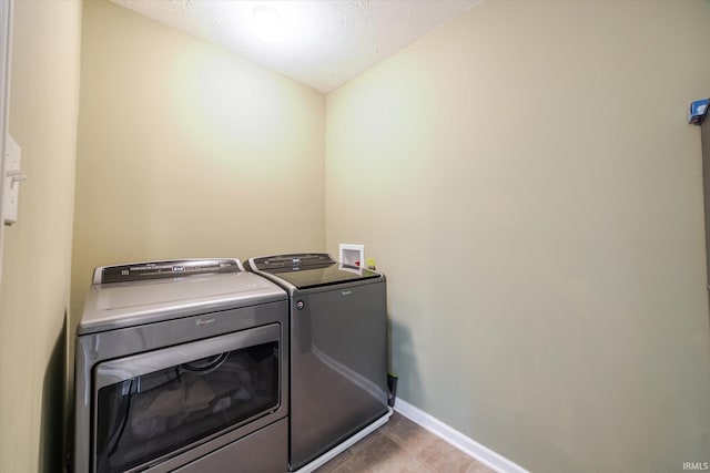 4671 W Hidden Meadow Dr, Bloomington, IN 47404 - laundry room with washing machine and clothes dryer and baseboards