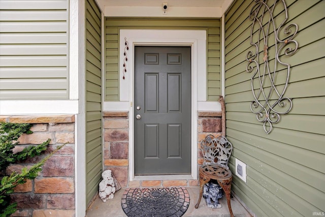 4671 W Hidden Meadow Dr, Bloomington, IN 47404 - view of exterior entry with a security system