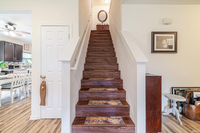 4671 W Hidden Meadow Dr, Bloomington, IN 47404 - stairs featuring ceiling fan and wood finished floors