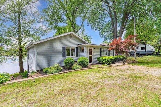 9465 E 1000 N, Syracuse, IN 46567 - ranch-style home featuring a front lawn