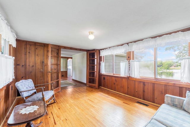 9465 E 1000 N, Syracuse, IN 46567 - living area with hardwood / wood-style flooring and wooden walls