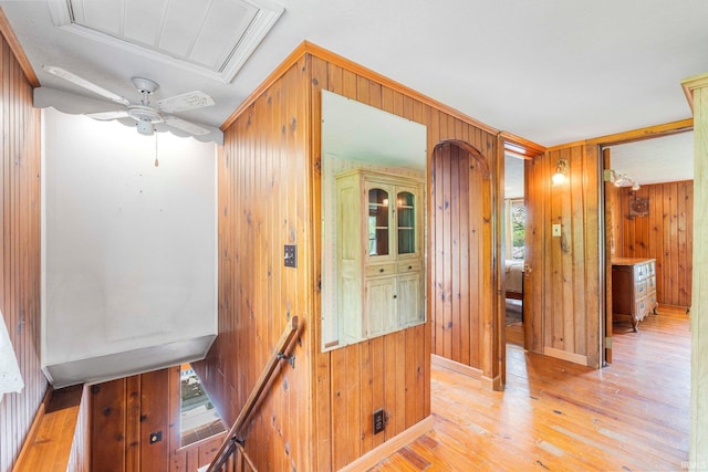 9465 E 1000 N, Syracuse, IN 46567 - hall featuring wooden walls, an upstairs landing, light wood-style flooring, plenty of natural light, and baseboards
