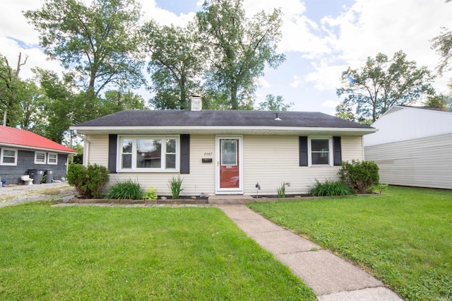 2067 Waggoner Ave, Evansville, IN 47714 - single story home with a front lawn and a chimney