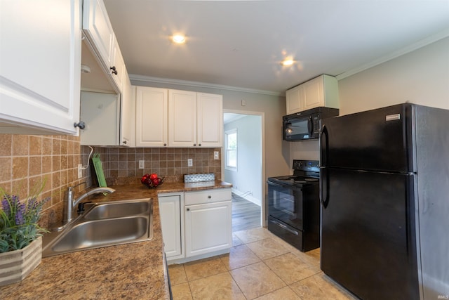 2067 Waggoner Ave, Evansville, IN 47714 - kitchen with black appliances, a sink, white cabinets, crown molding, and backsplash