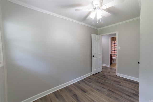 2067 Waggoner Ave, Evansville, IN 47714 - unfurnished room with dark wood-style flooring, baseboards, a ceiling fan, and crown molding