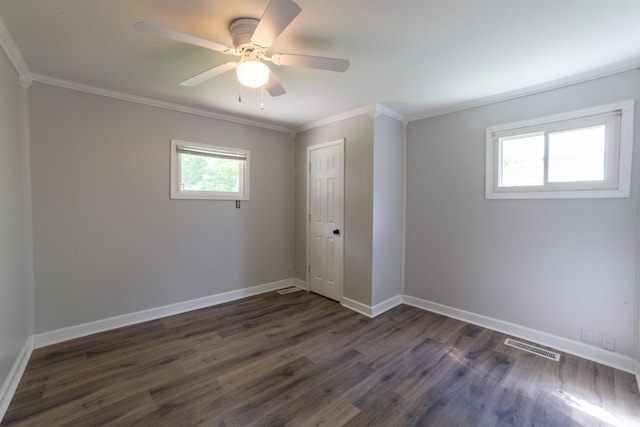 2067 Waggoner Ave, Evansville, IN 47714 - unfurnished room featuring dark wood-style floors, crown molding, baseboards, and ceiling fan