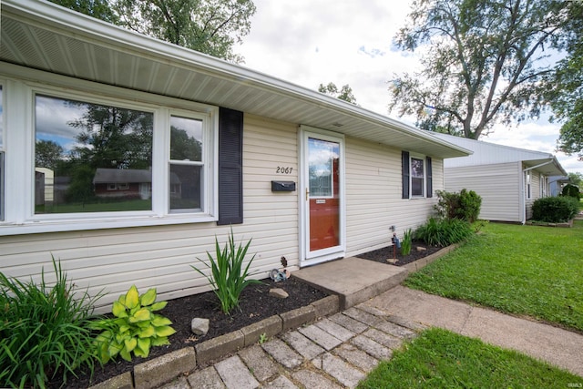 2067 Waggoner Ave, Evansville, IN 47714 - doorway to property featuring a lawn