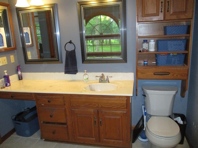 22715 Fair Oaks Ct, Elkhart, IN 46514 - bathroom featuring vanity, toilet, and tile patterned floors