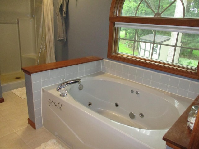 22715 Fair Oaks Ct, Elkhart, IN 46514 - bathroom featuring tile patterned flooring, a jetted tub, and walk in shower