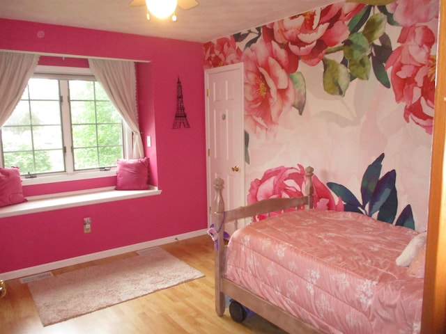22715 Fair Oaks Ct, Elkhart, IN 46514 - bedroom with wood finished floors, baseboards, and a ceiling fan