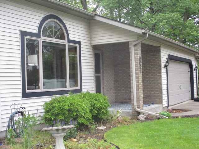 22715 Fair Oaks Ct, Elkhart, IN 46514 - view of home's exterior with brick siding and a garage