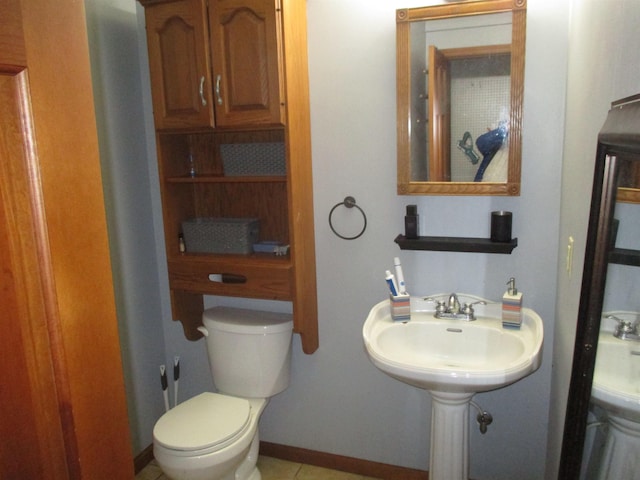 22715 Fair Oaks Ct, Elkhart, IN 46514 - half bath featuring toilet and tile patterned flooring