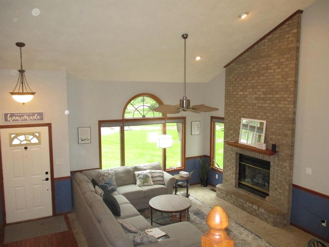 22715 Fair Oaks Ct, Elkhart, IN 46514 - living room featuring vaulted ceiling, a brick fireplace, and ceiling fan