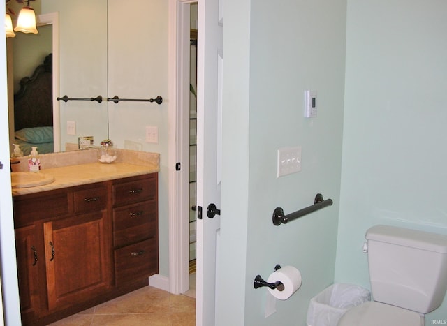 8036 Wolf Creek Ct, Evansville, IN 47712 - bathroom with connected bathroom, toilet, tile patterned floors, and vanity