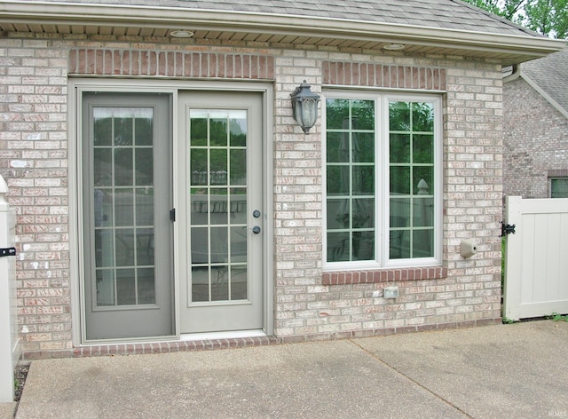 8036 Wolf Creek Ct, Evansville, IN 47712 - doorway to property with brick siding and a shingled roof