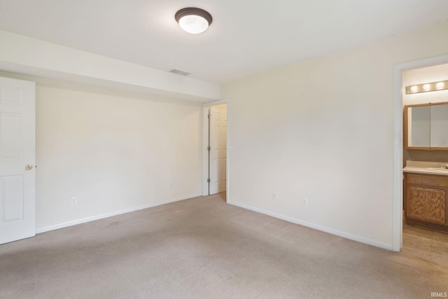 3260 E Sherman St, Columbia City, IN 46725 - spare room with light carpet, baseboards, and a sink