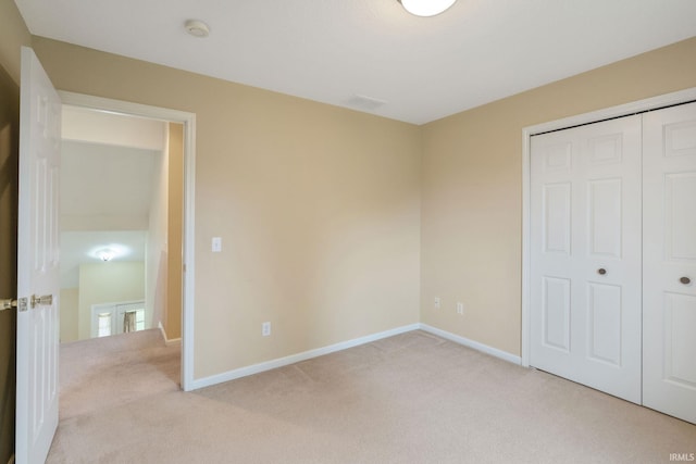 3260 E Sherman St, Columbia City, IN 46725 - unfurnished bedroom featuring light colored carpet, a closet, and baseboards