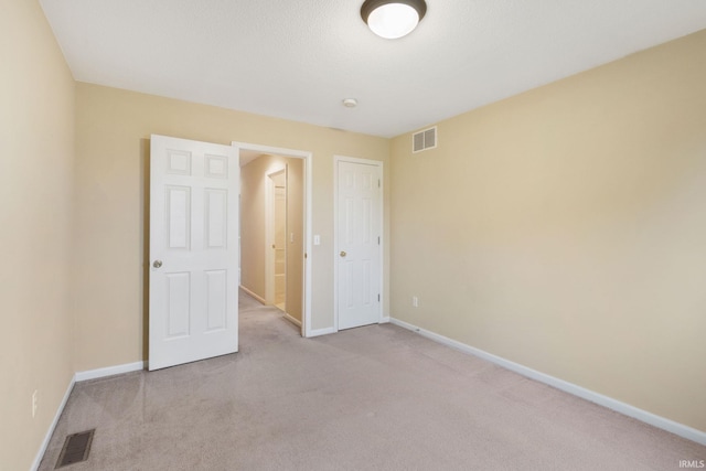 3260 E Sherman St, Columbia City, IN 46725 - unfurnished bedroom featuring light colored carpet and baseboards