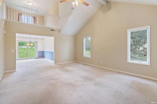 3260 E Sherman St, Columbia City, IN 46725 - unfurnished living room featuring high vaulted ceiling, carpet flooring, ceiling fan, beamed ceiling, and a chandelier