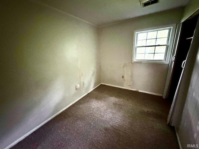 207 S Poplar Dr, Bloomington, IN 47429 - unfurnished bedroom with carpet floors and baseboards