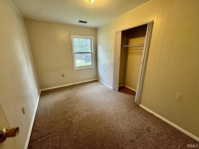 207 S Poplar Dr, Bloomington, IN 47429 - unfurnished bedroom with carpet, a closet, and baseboards