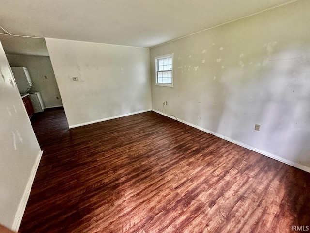 207 S Poplar Dr, Bloomington, IN 47429 - unfurnished room featuring wood finished floors and baseboards