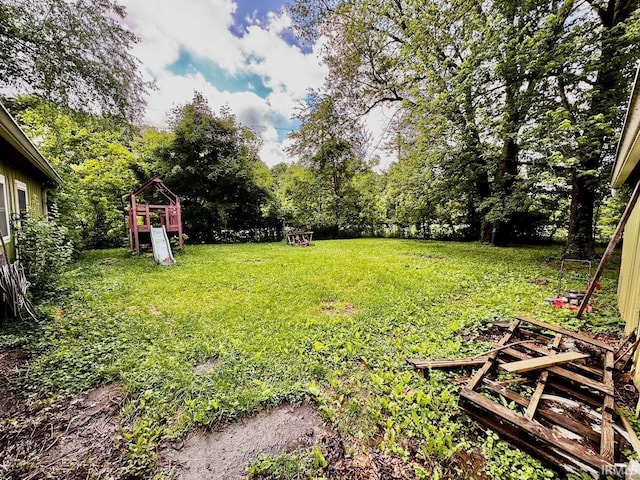 207 S Poplar Dr, Bloomington, IN 47429 - view of grassy yard featuring a playground