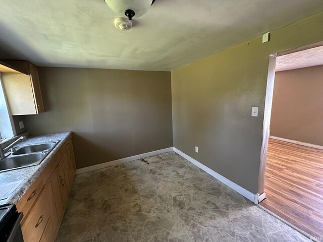 2118 Homewood Ave, Mishawaka, IN 46544 - kitchen featuring a sink, baseboards, and stove