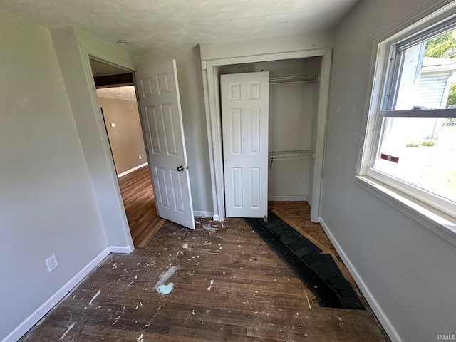 2118 Homewood Ave, Mishawaka, IN 46544 - unfurnished bedroom with hardwood / wood-style flooring, a closet, and baseboards