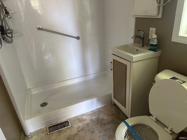 2118 Homewood Ave, Mishawaka, IN 46544 - bathroom featuring toilet, a stall shower, and vanity