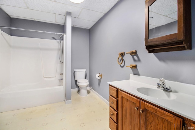 724 E Mishawaka Ave, Mishawaka, IN 46545 - bathroom with toilet,  shower combination, vanity, baseboards, and a paneled ceiling