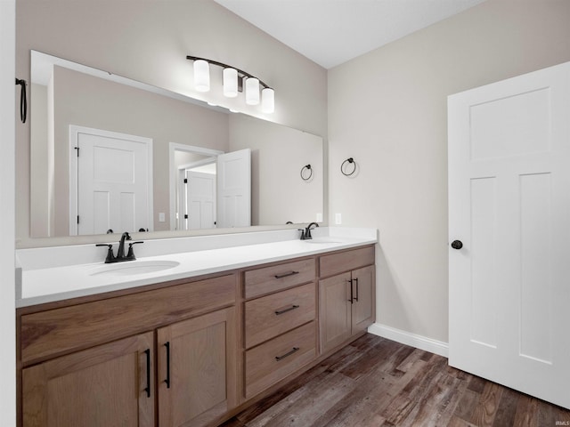 16927 Hillsong Ln, Huntertown, IN 46748 - full bath with wood finished floors, double vanity, and baseboards