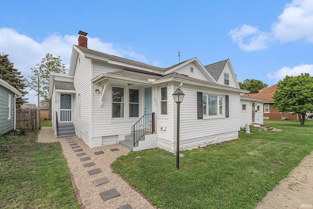 420 W 10th St, Mishawaka, IN 46544 - view of front of home featuring a chimney, entry steps, and a shingled roof