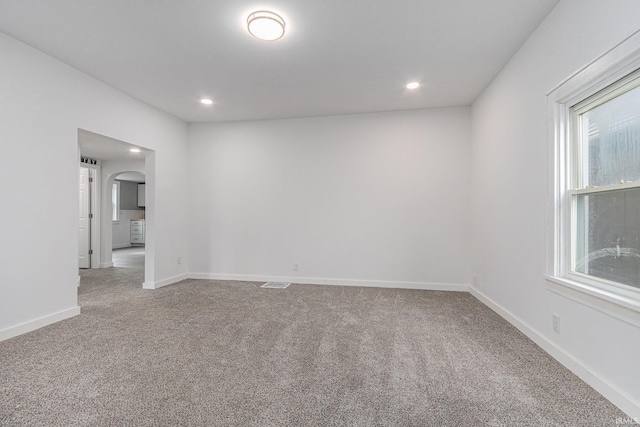 420 W 10th St, Mishawaka, IN 46544 - spare room featuring carpet, arched walkways, recessed lighting, and baseboards