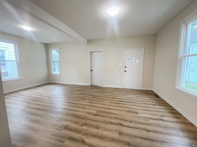 511 E 3rd St, Peru, IN 46970 - spare room featuring wood finished floors and baseboards